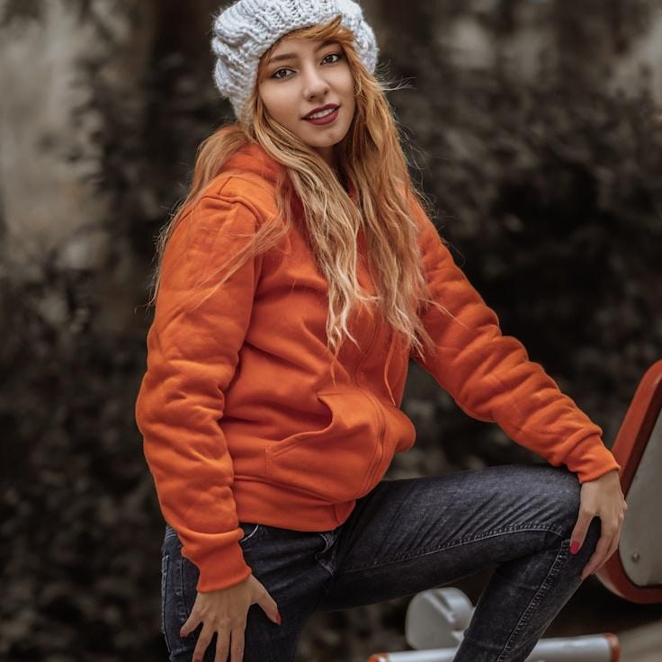 Aria Malik, Lead Design Curator at Harbor Bloom Canyon, reviewing corporate floral arrangements